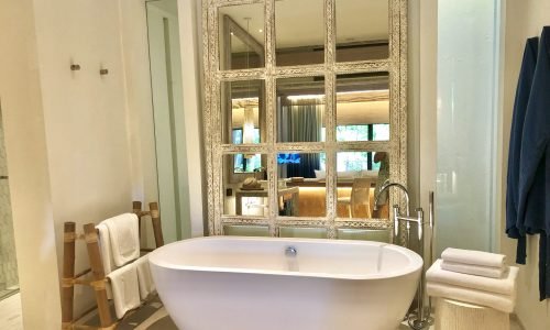 bathroom interior background and white spa towels on wood.
